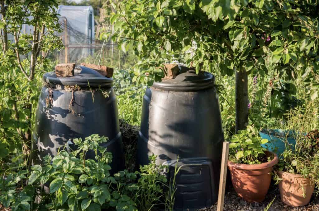 two plastic compost bins